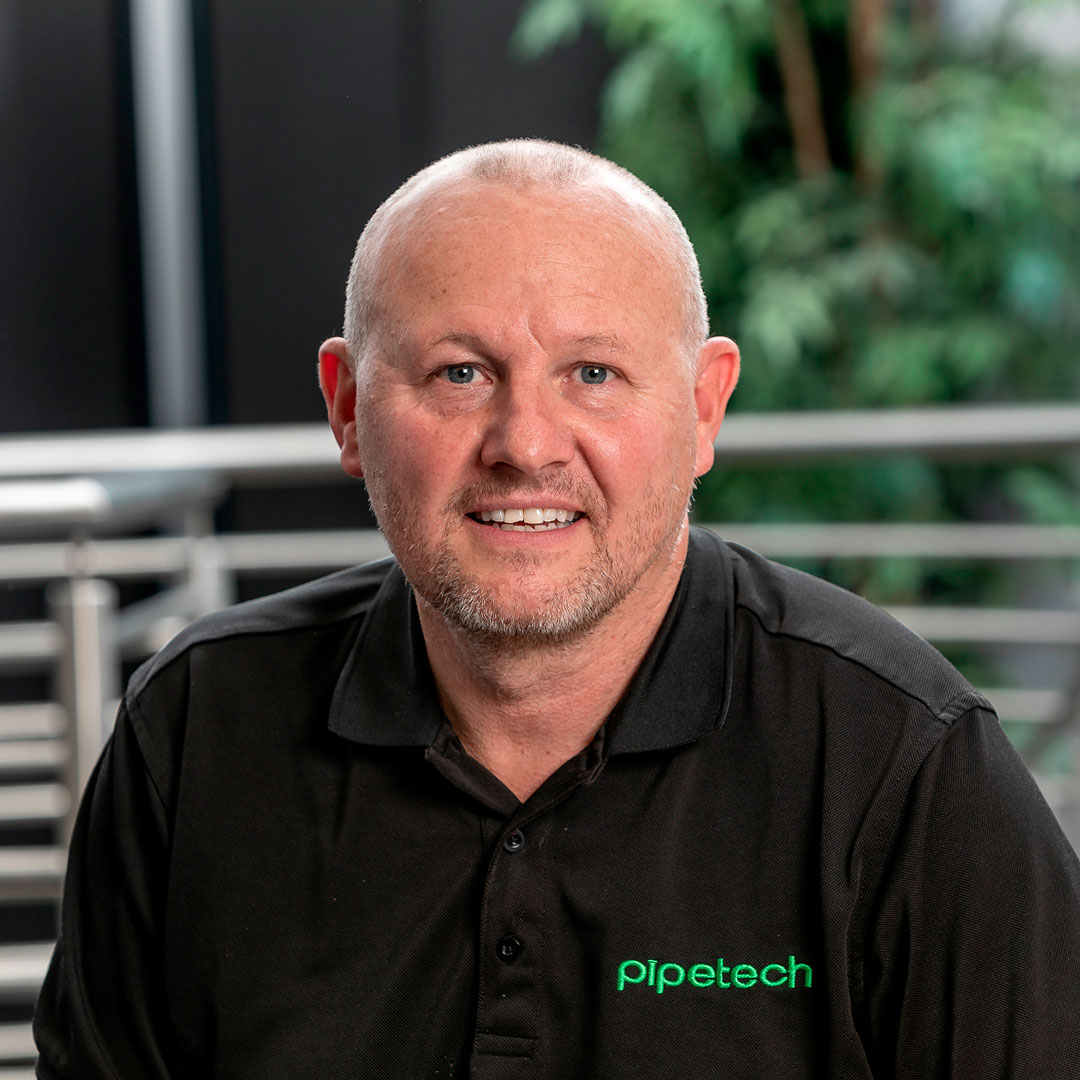Bald man wearing a black branded t-shirt.